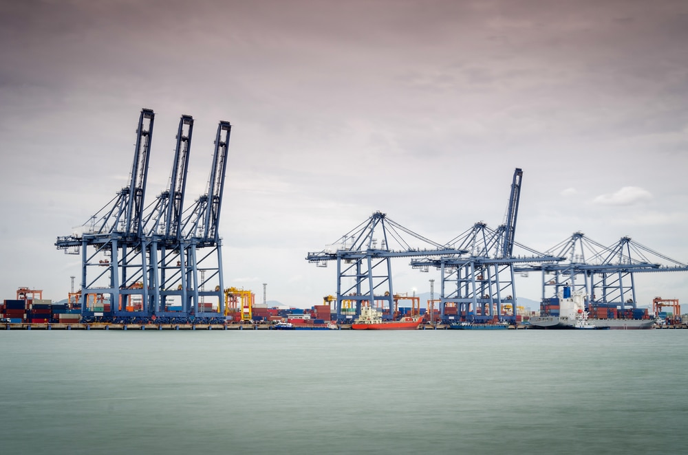 containers,loading,by,crane,in,the,morning,,,trade,port